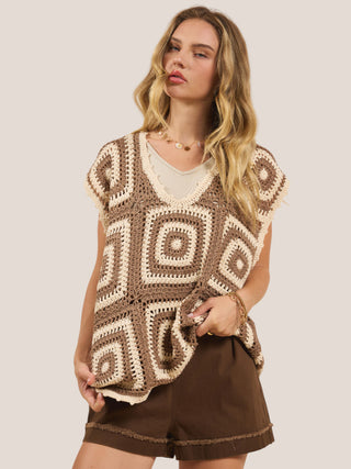 a fun brown and cream oversized patchwork crochet sweater vest