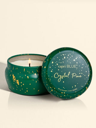 emerald green and golden mini tin holiday candle in the crystal pine scent