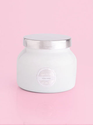 a large white ceramic tropical punch scented candle