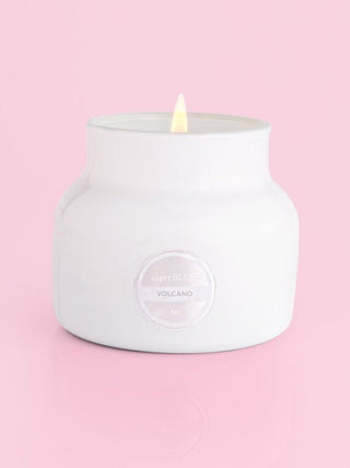 a large white tropical punch scented candle in a jar vessel