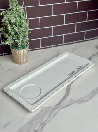 a white ceramic tray with a light up sitter spot for the holidays