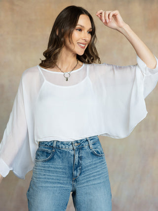 white airy cropped blouse with quarter length sleeves 