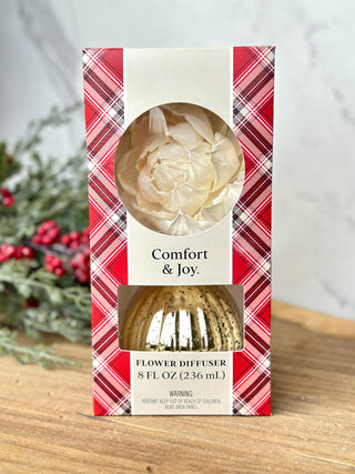 a festive gold flower diffuser with seasonal scents