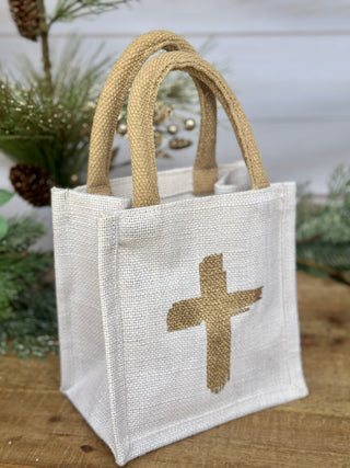 a natural gift tote bag with a gold metallic cross