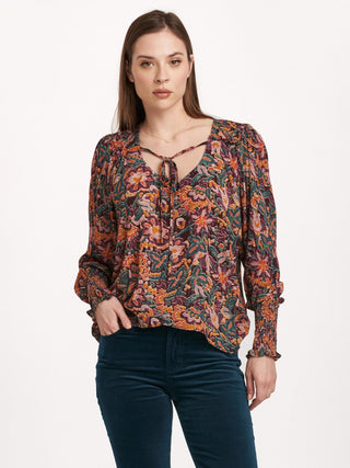 floral v neck blouse that features long sleeves and a playful tie front