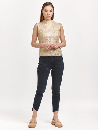 crew neck sleeveless fitted sweater in ivory with rose gold with shiny metallic foil paired with black high rise denim pants 