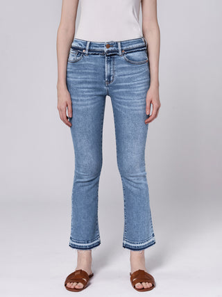 a pair of light wash denim mid rise jeans with a cropped straight leg and raw hem