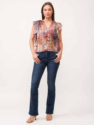 multi colored floral print v neck blouse with ruffle cap sleeve worn with dark wash denim jeans 