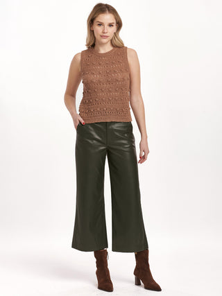 a nutshell sleeveless knit sweater with classic crew neck worn with black pants