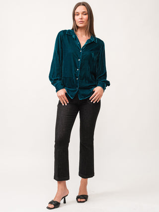 deep teal velvet long sleeve button down shirt styled with cropped black pants