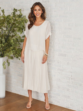 a comfortable creamy beige italian silk midi dress with a layered look