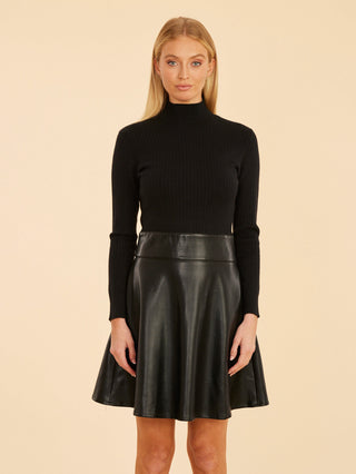 a unique black mini dress with a soft knit top half and faux leather bottom