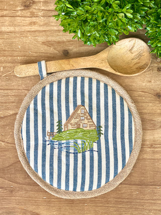 blue and white striped lake house pot holder with wooden spoon attached