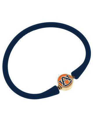 a navy silicone stackable bali bracelet with gold plated auburn logo bead clasp