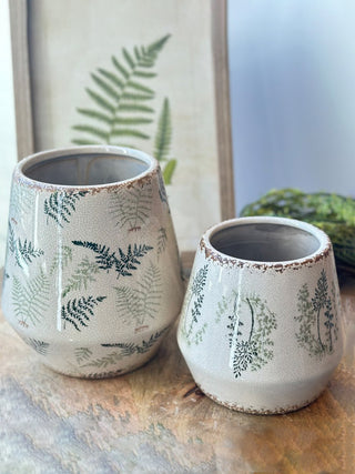 white and cream ceramic pots with a fresh green fern pattern