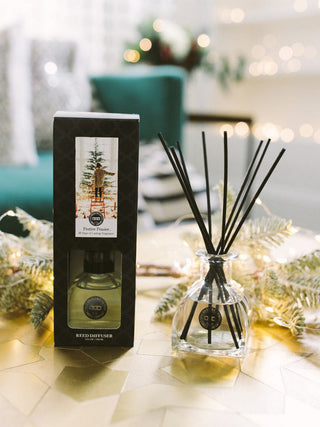 a festive fraiser reed diffuser with seasonal scents