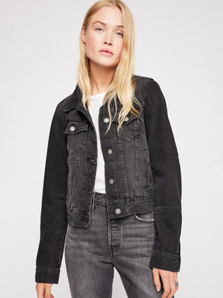 a classic black denim button up jacket with side pockets