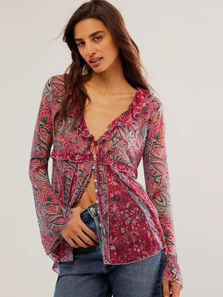 printed raspberry tunic with a deep v neckline and feminine ruffled trim