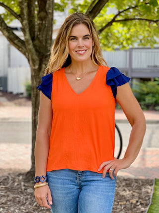 a flowy orange and navy short flutter sleeve game day top