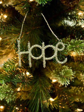 decorate your christmas tree with a cursive beaded word ornament in green that reads hope for holiday home decor