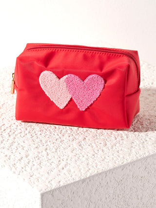 a flirty red cosmetic pouch with fuzzy pink valentine hearts