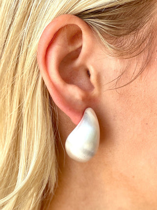 silver puffed teardrop stud earrings with a satin finish