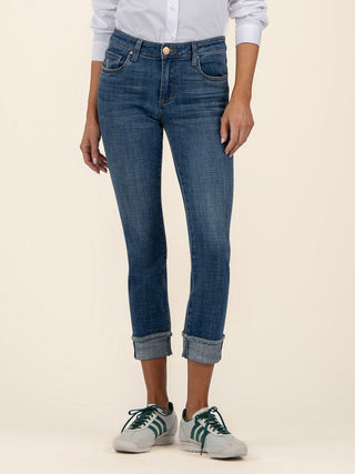 a pair of straight leg dark wash denim jeans with rolled cuff