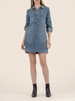 a long sleeve blue henley denim mini dress with front buttons a chic collar worn with brown boots