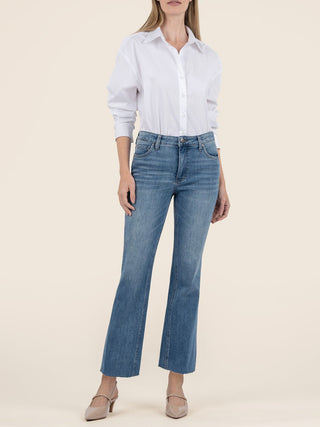 flattering ankle cropped flare denim jeans worn with a white blouse