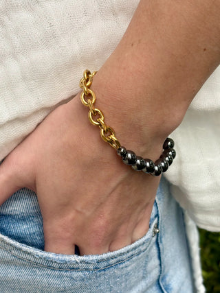 stretch bracelet with a unique artisan gold chain and bold black hematite beads