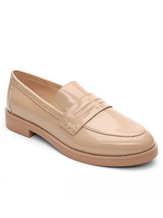 a classic pair of slip on patent leather nude loafers