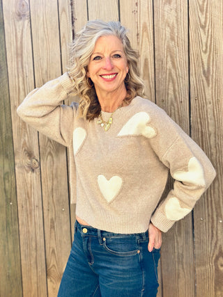 a cute taupe lover sweater with bold white hearts