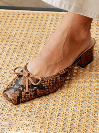 a comfy pair of brown snake embossed leather kitten heel mules