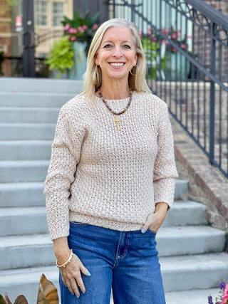 a cozy crewneck open knit cream sweater