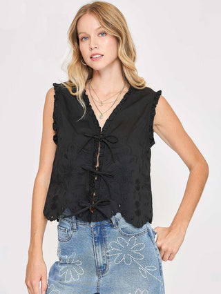 a black embroidered sleeveless tie front top