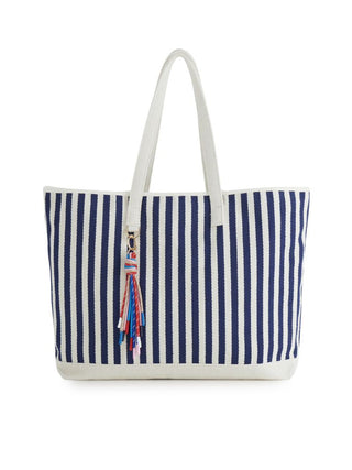 a large navy and white striped vacation tote bag with a long handle