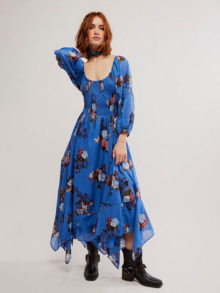 a freeing maxi dress in a fun blue floral pattern and flattering silhouette with flair