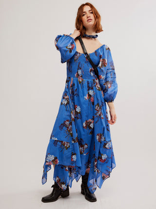 a freeing maxi dress in a fun blue floral pattern and flattering silhouette with flair