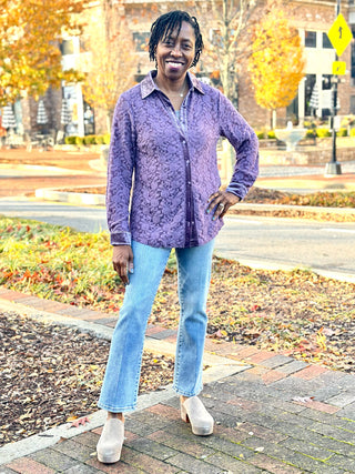 a purple lavender lace button down collared shirt with velvety details worn with light blue jeans