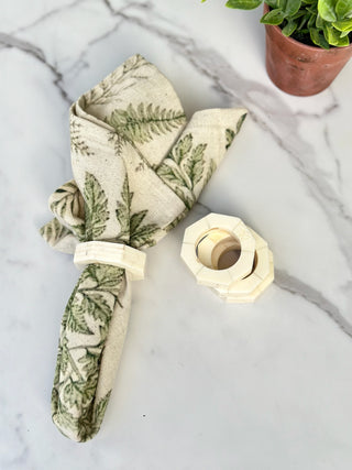 a cream resin octagon napkin ring set