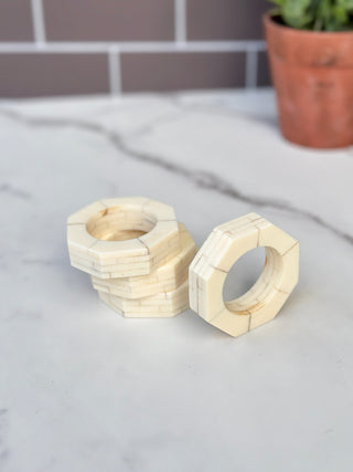 a cream stone resin octagon napkin ring set