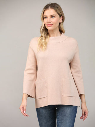 a simple rose gold mock neck sweater with three quarter sleeves