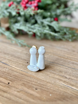 a white ceramic nativity scene pocket gift