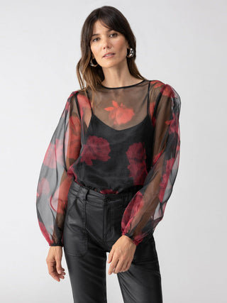 a fun sheer black and red rose long sleeve blouse for a night out