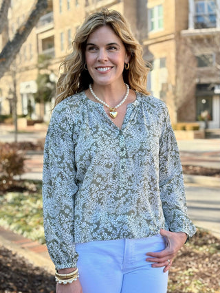 a green and white paisley long sleeve blouse