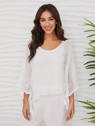 a beachy white crotchet open knit top with dolman sleeves and included cami top