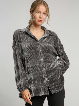 a velvet tiered gunmetal gray top with long puff sleeves and button front with smocking detail