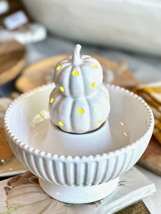 a white ceramic candy bowl with a decor sitter spot in the middle