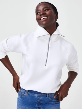 a soft half zip white pullover with a refined collar