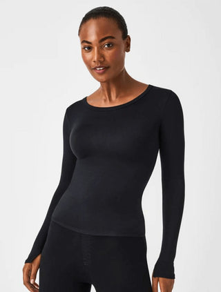 a basic black spanx long sleeve crew neck body skimming top